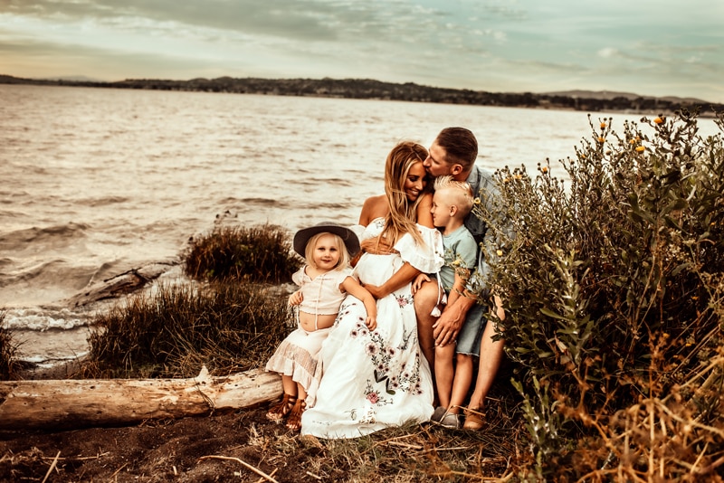 Bay Area Maternity Photography, family of 4 sitting next to the water