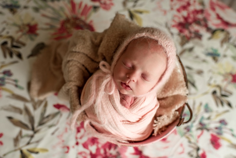 Bay Area Newborn Photography, baby asleep in basket on floral background